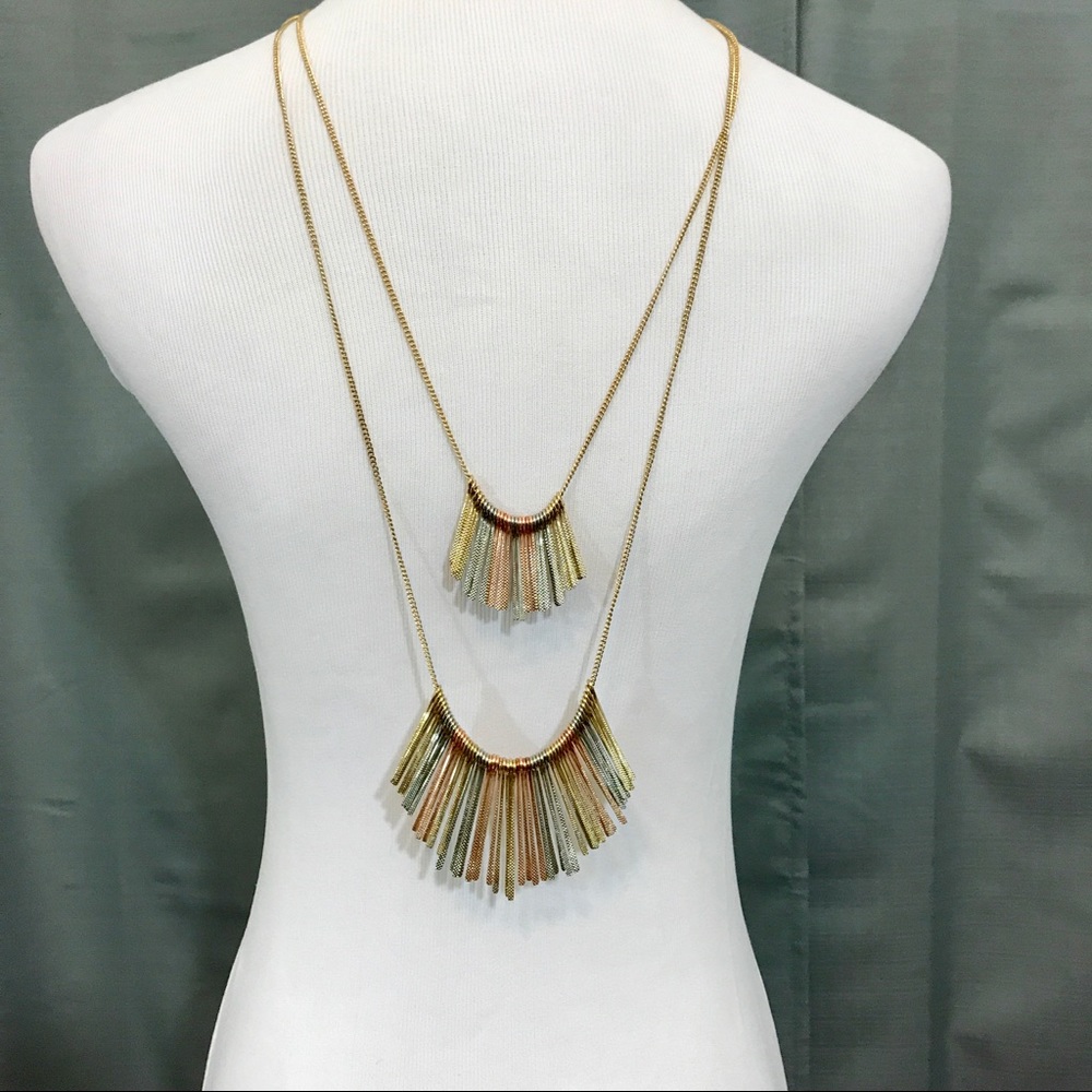 Double strand tri gold necklace.
